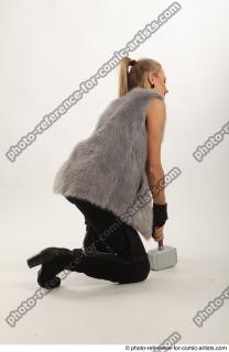 16 2018 01 NIKOL  KNEELING POSE WITH HAMMER